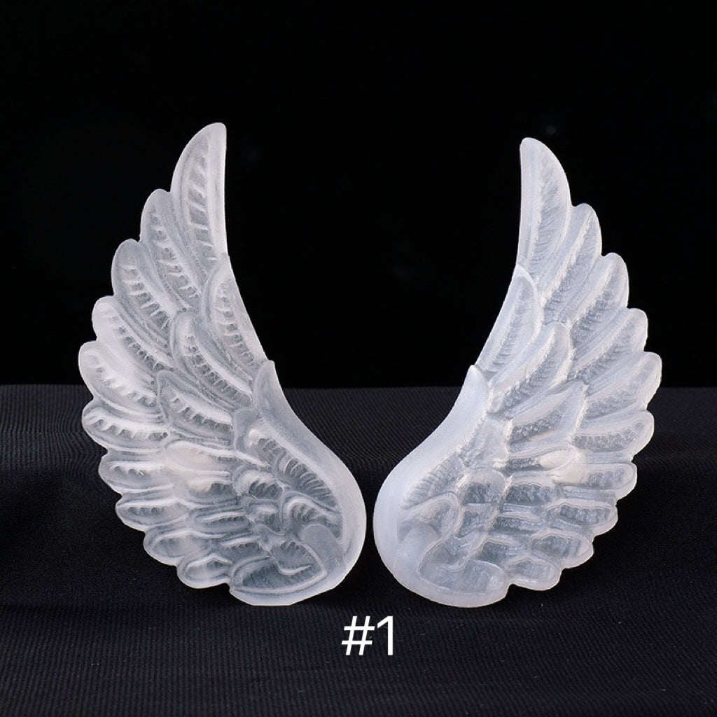 Selenite angel wing carvings