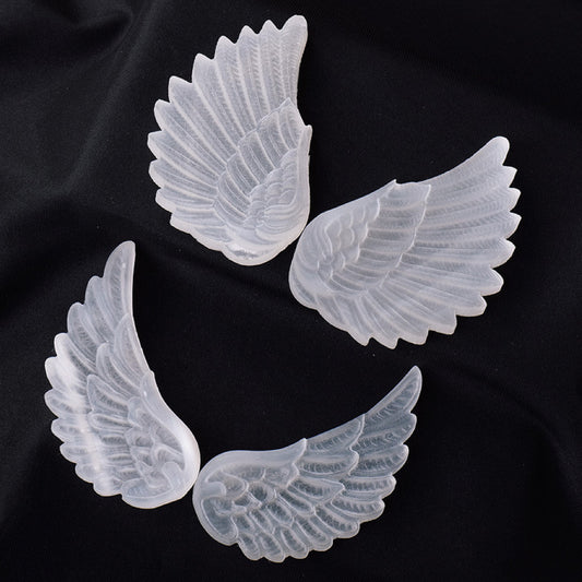 Selenite angel wing carvings
