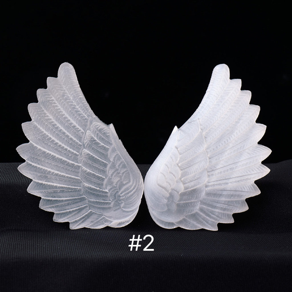 Selenite angel wing carvings